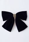 Barrette à cheveux en velours avec chaîne dorée et nœud papillon en noir