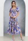 Robe midi vibrante à manches bulles et tulipes en bleu