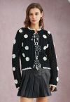 Cardigan tricoté à la main avec fermeture à nouer soi-même et motif floral