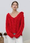 Pull en maille torsadée épaisse à col en V en rouge