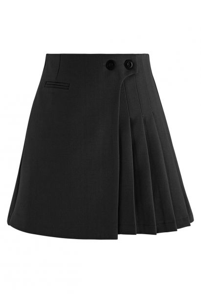 Mini-jupe plissée à deux boutons en noir