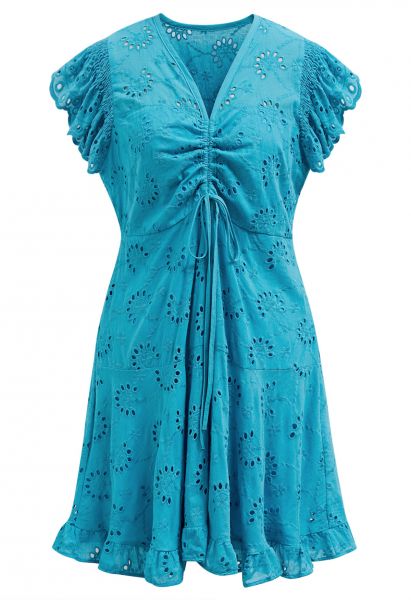 Mini-robe brodée à œillets et cordon de serrage sur le devant, en bleu