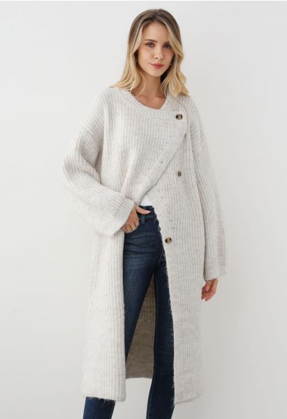 Cardigan long en tricot boutonné asymétrique enveloppé de chaleur en blanc