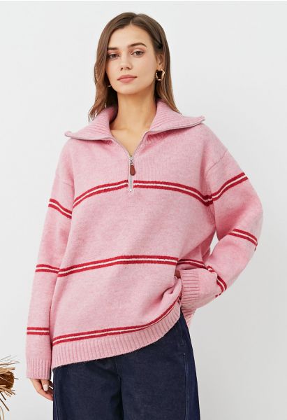 Pull en tricot à rayures sportives et col zippé en rose