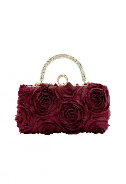 Pochette opulente avec poignée en strass rose en bordeaux