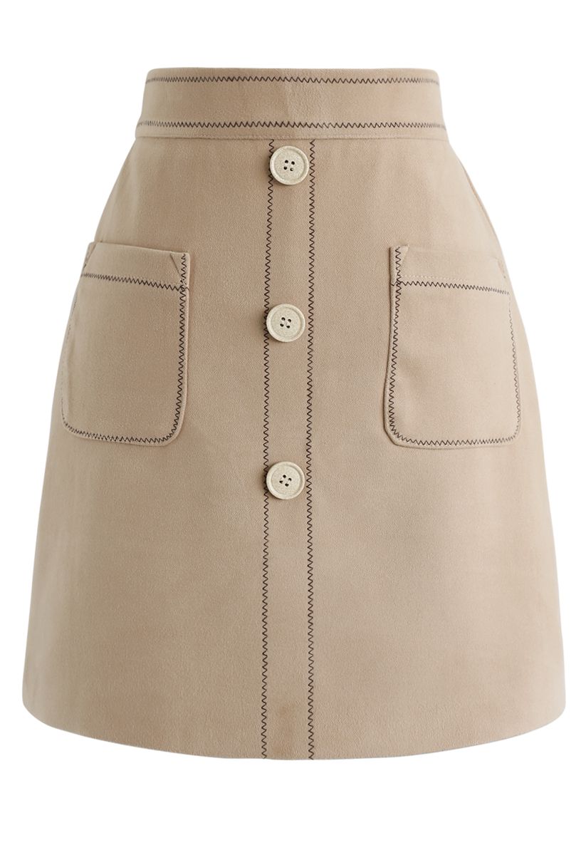 Mini-jupe boutonnée à poches contrastées en fauve