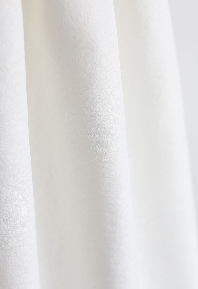 Jupe mi-longue trapèze plissée en jacquard en blanc