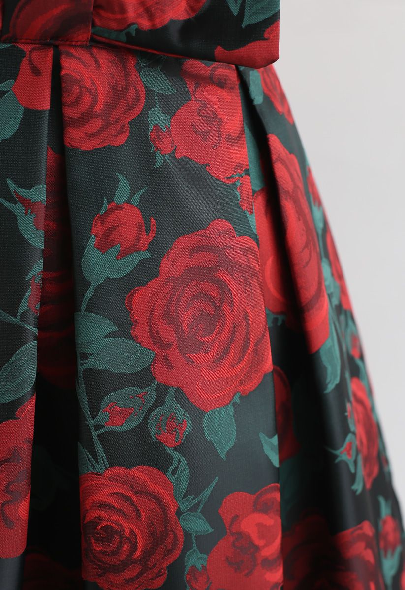 Mini-jupe plissée à imprimé rose rouge et nœud papillon