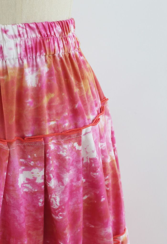 Jupe mi-longue plissée à volants tie-dye en rose vif