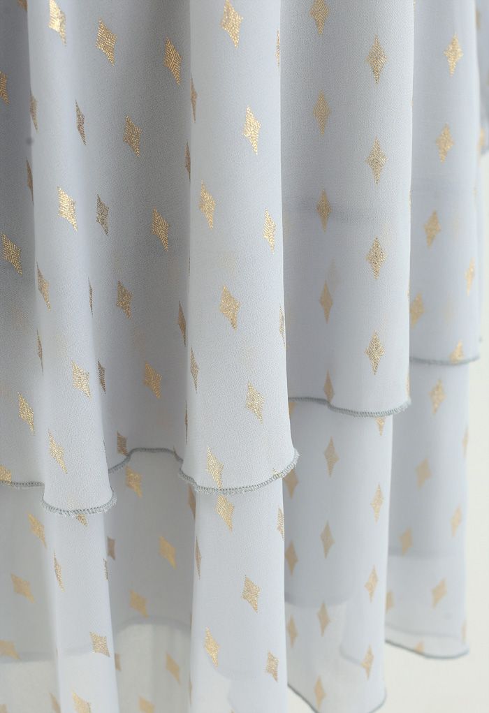 Robe mi-longue en mousseline de soie plissée à imprimé losanges dorés