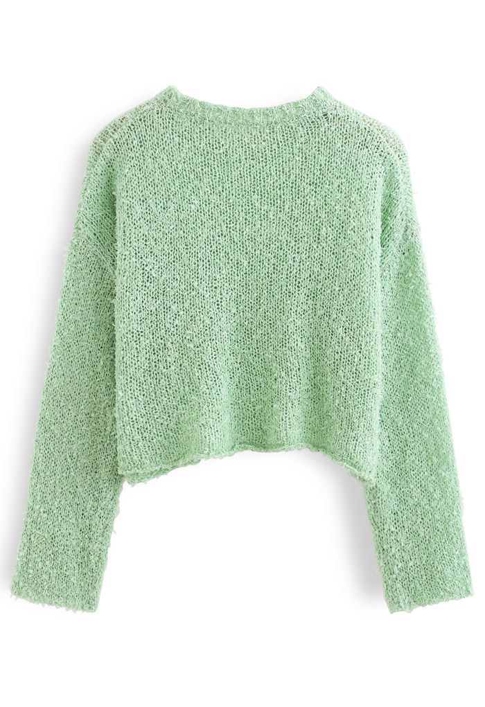 Pull court en tricot moelleux évidé en vert pois