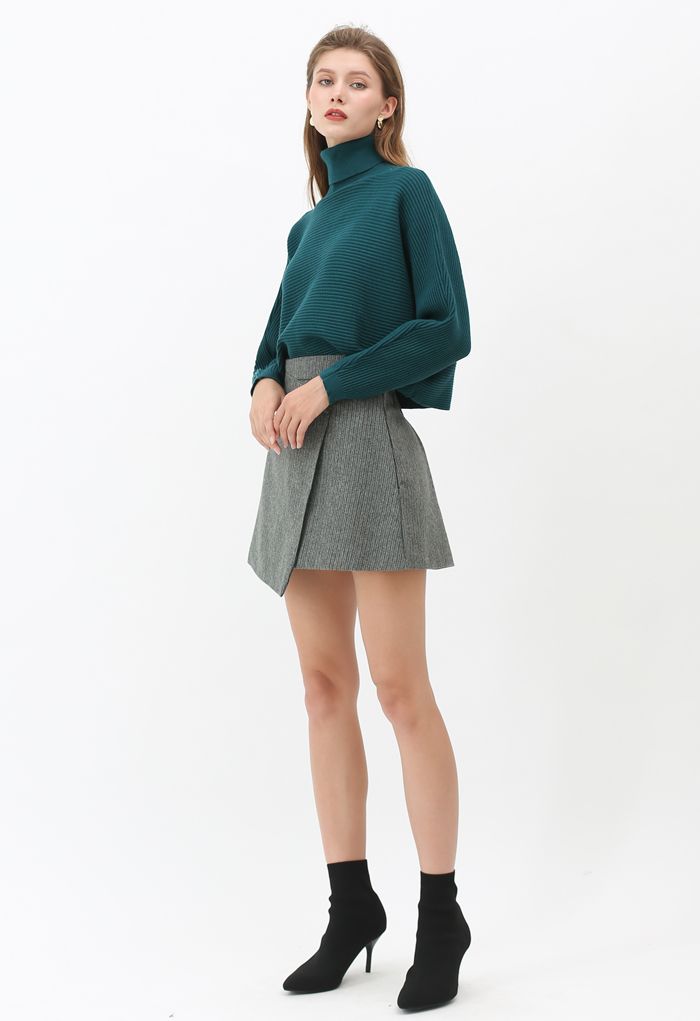 Mini-jupe en laine mélangée à rabat boutonné en vert foncé