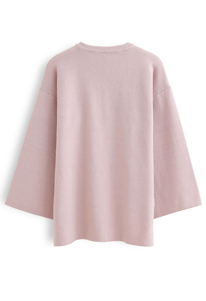 Pull en tricot à manches évasées boutonné en rose