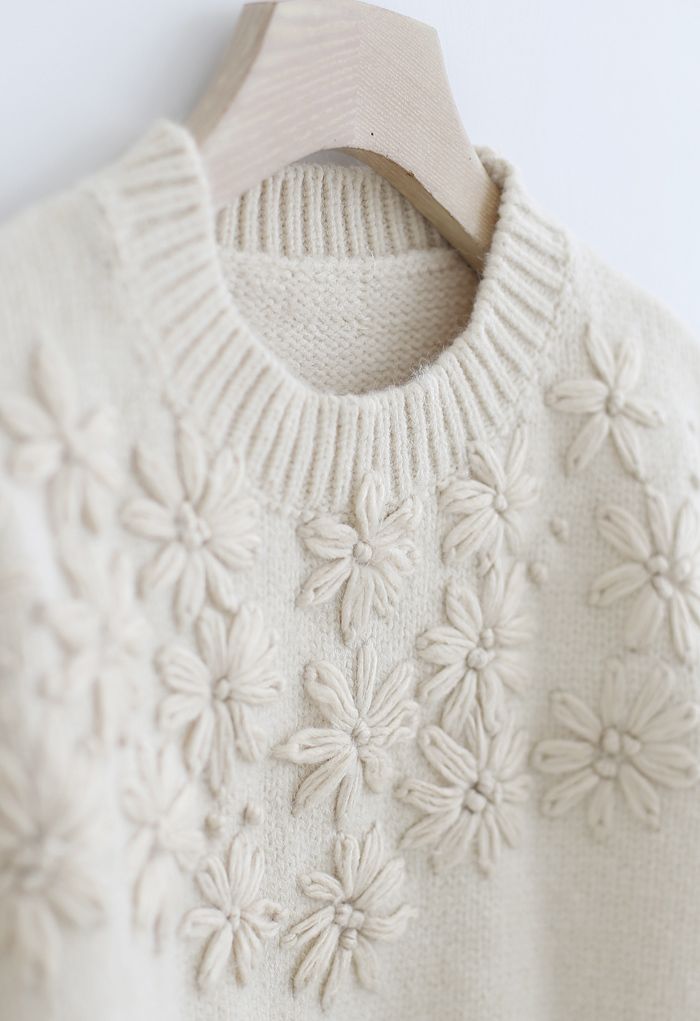Pull en tricot à manches bouffantes et fleurs