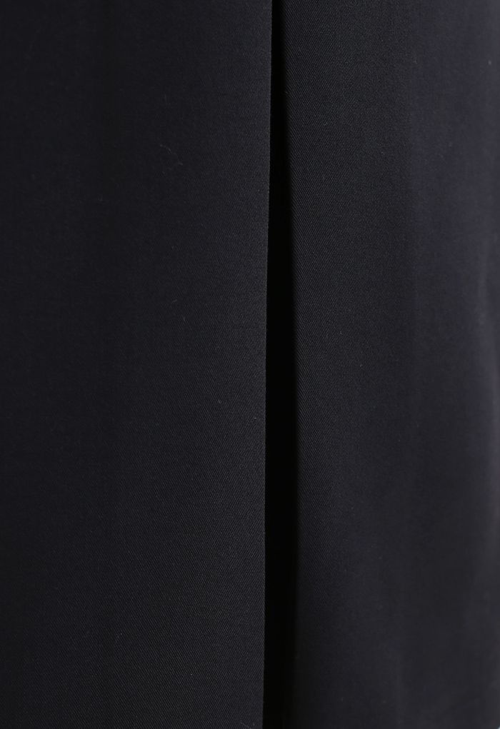 Jupe mi-longue fendue à ourlet plissé en noir