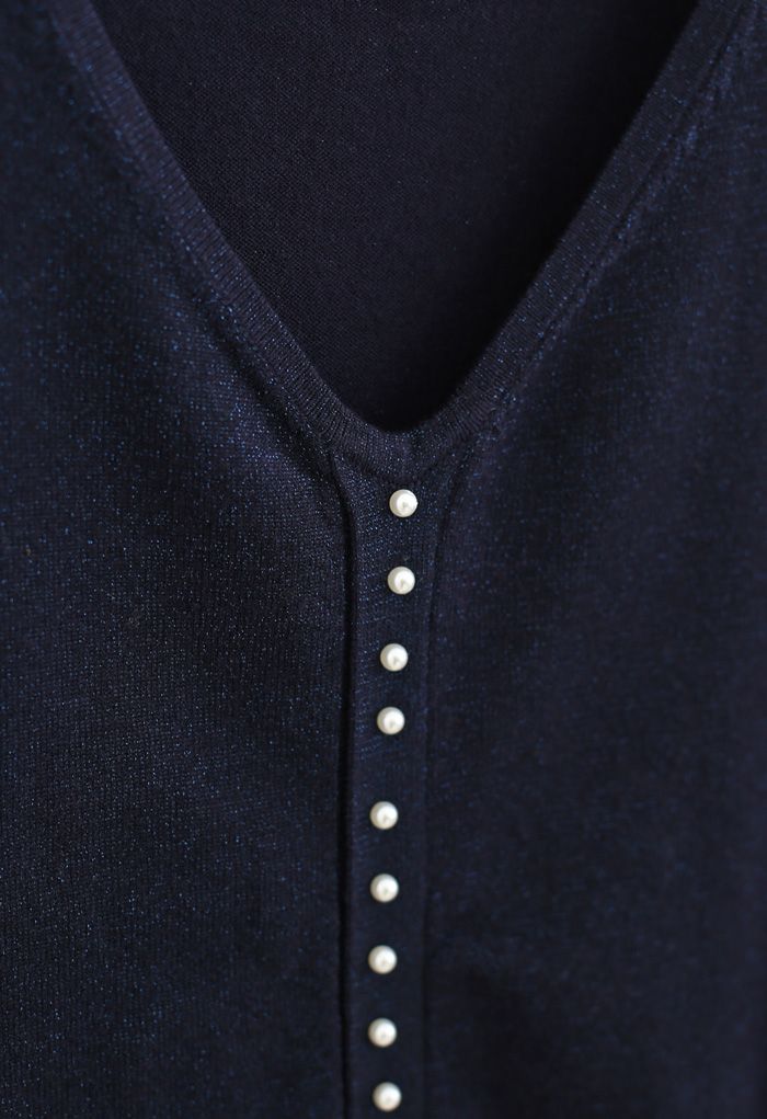 Haut en tricot scintillant à bordure perlée en bleu marine