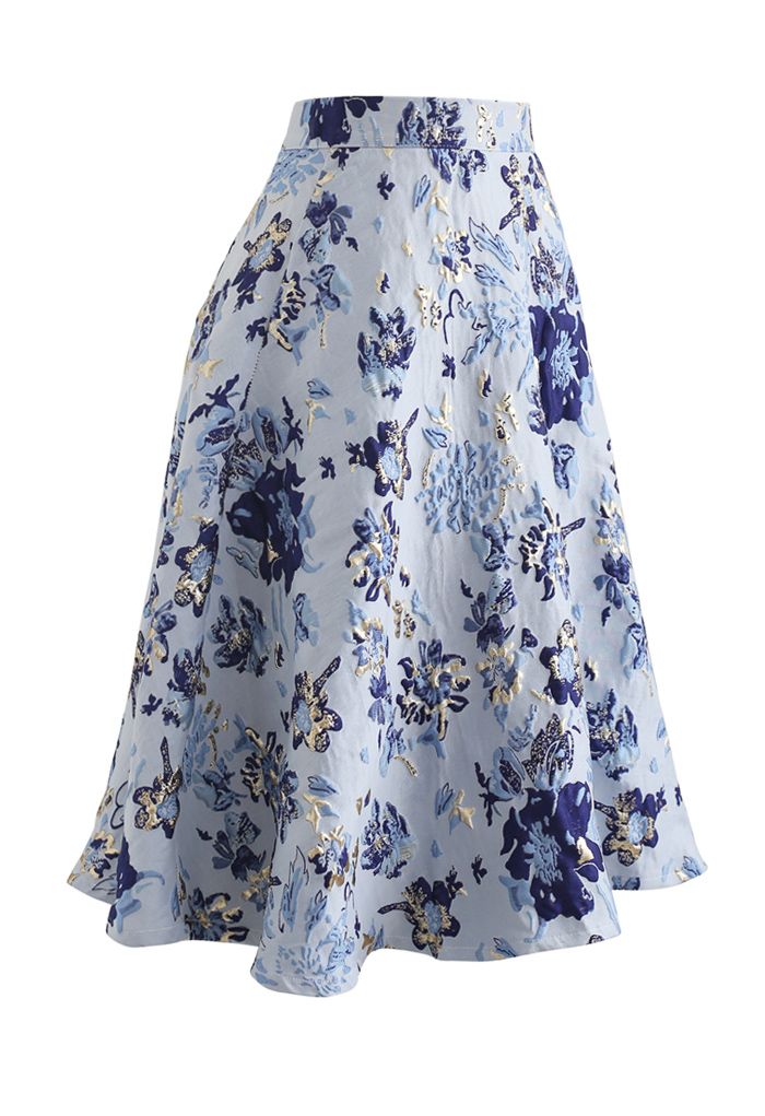 Jupe mi-longue bleue en jacquard à fleurs embossées