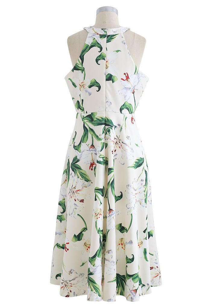 Superbe robe mi-longue à imprimé floral et licou en vert