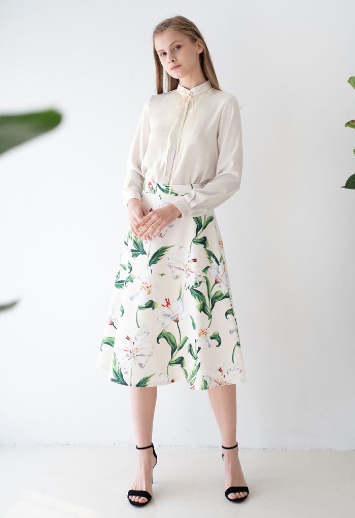 Superbe jupe mi-longue trapèze à imprimé floral en vert