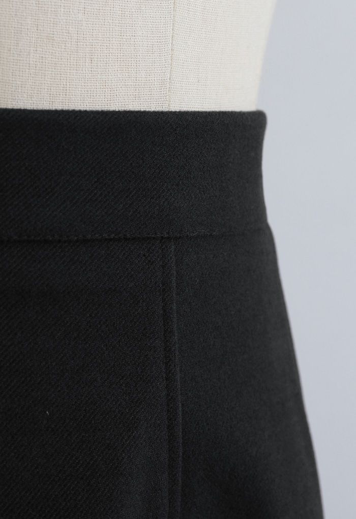 Jupe mi-longue en laine mélangée de couleur unie en noir