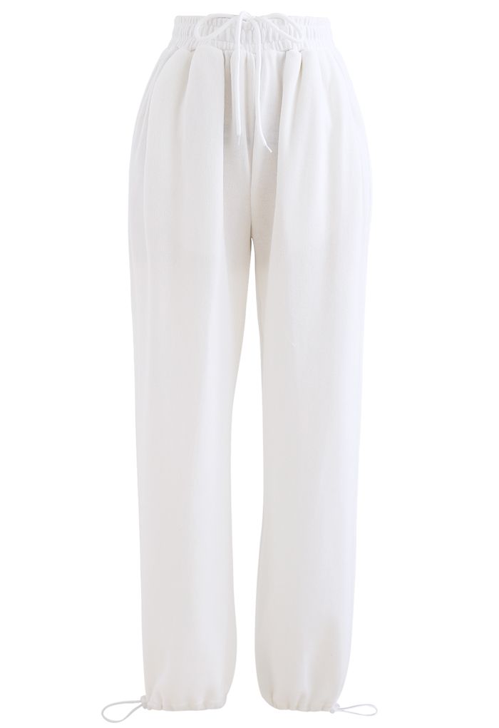 Pantalon de jogging avec cordon de serrage et poche plaquée cœur en blanc