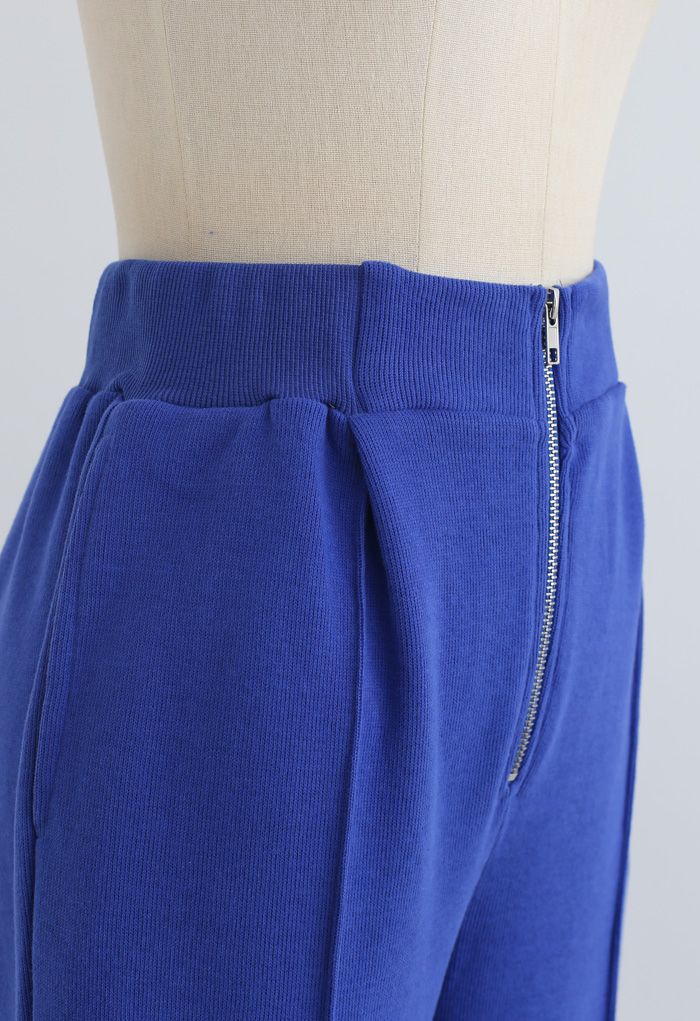 Pantalon de jogging zippé avec poches latérales sur le devant en bleu