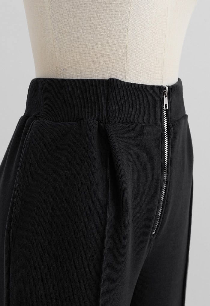 Pantalon de jogging zippé avec poche latérale sur le devant en noir