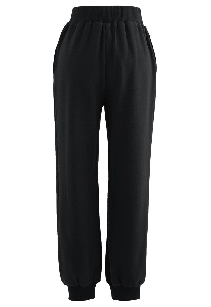Pantalon de jogging zippé avec poche latérale sur le devant en noir
