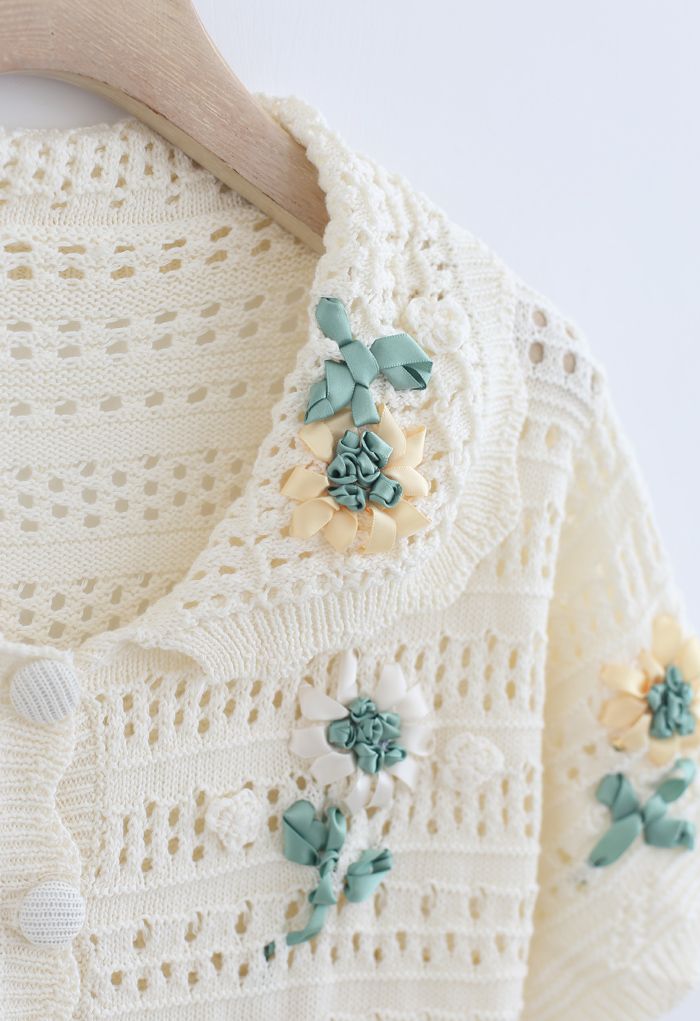 Cardigan tricoté à la main en tricot fleuri à œillets en crème