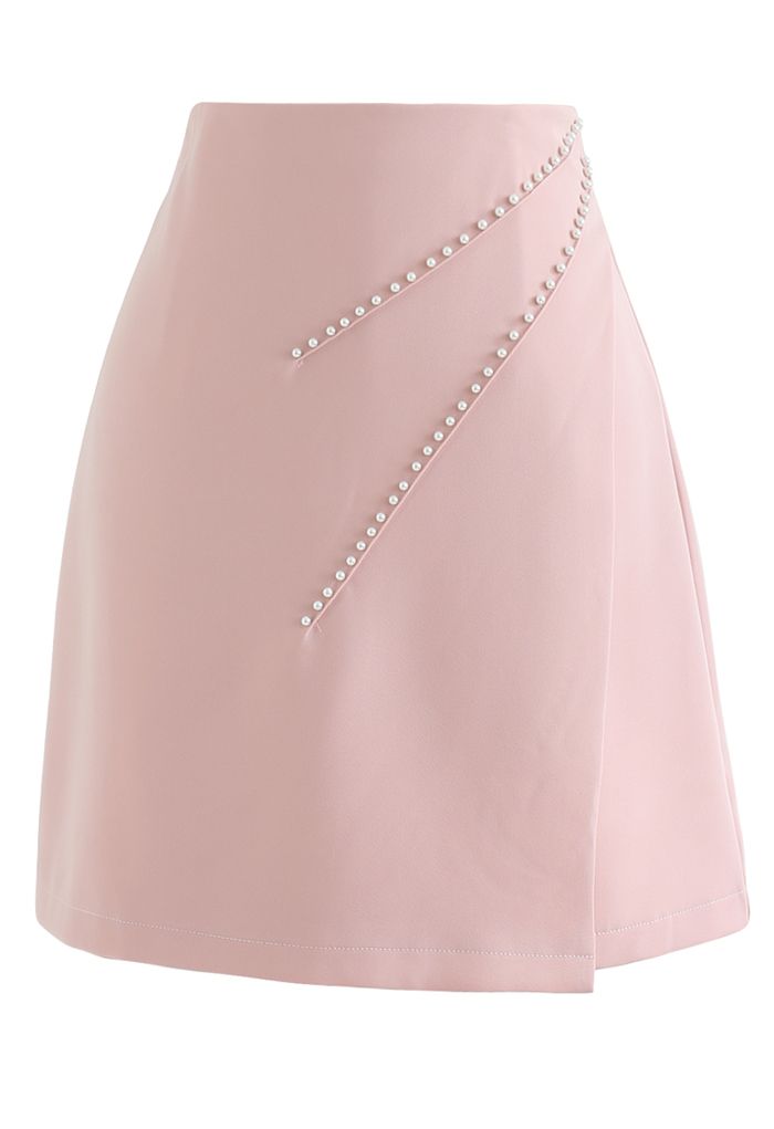 Mini-jupe à rabat ornée de perles en rose