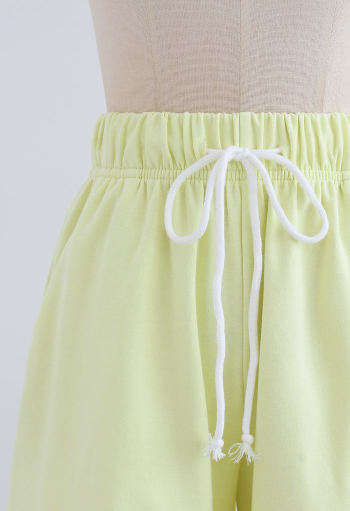 Short avec poches à cordon de serrage et ourlet replié en citron vert