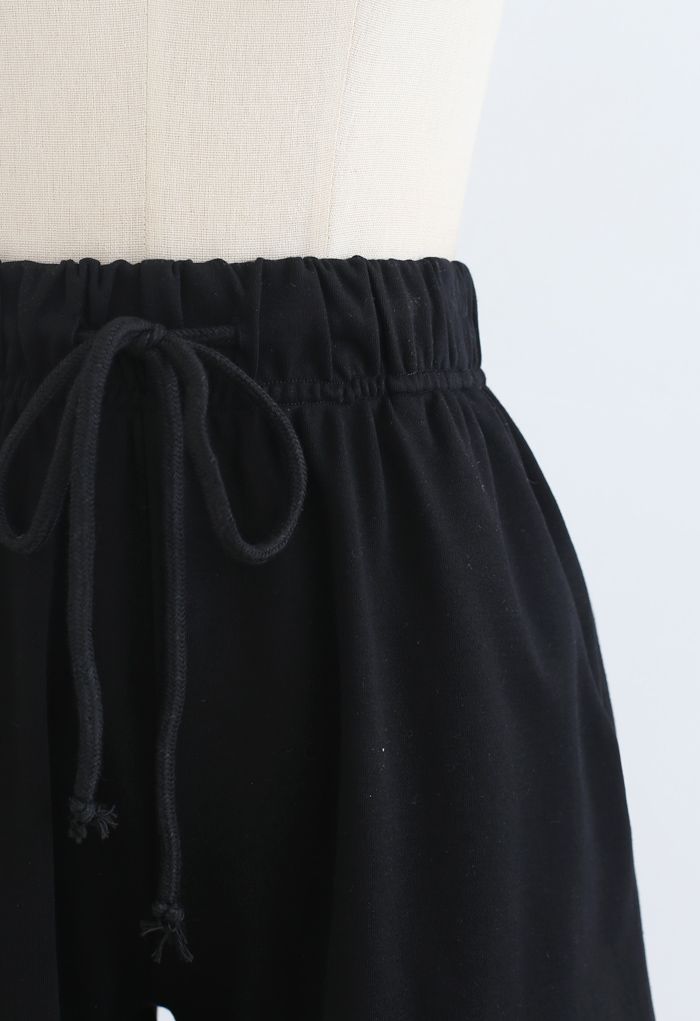 Short avec poches à cordon de serrage et ourlet replié en noir