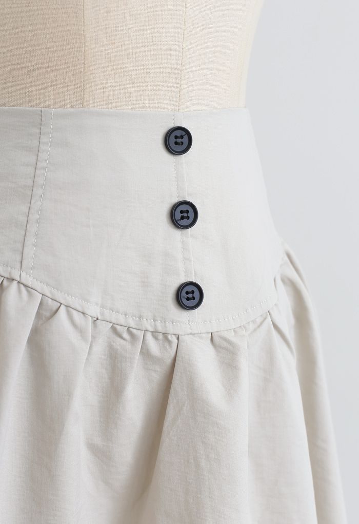 Mini-jupe taille haute à boutons en ivoire