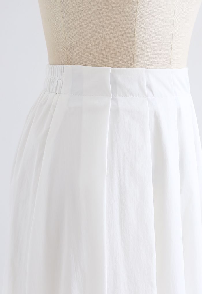 Jupe mi-longue plissée trapèze en coton blanc