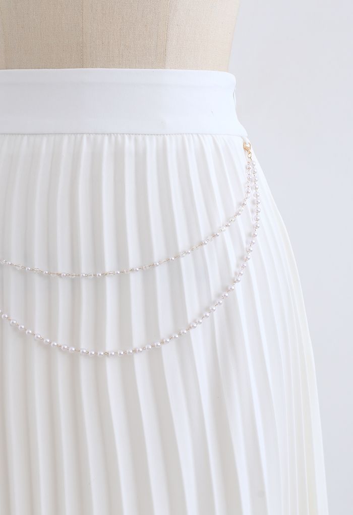 Jupe mi-longue plissée à chaîne drapée en blanc