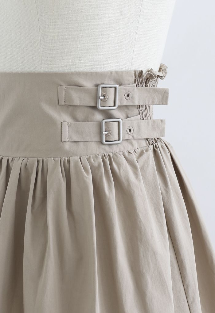 Mini-jupe plissée à double ceinture en sable