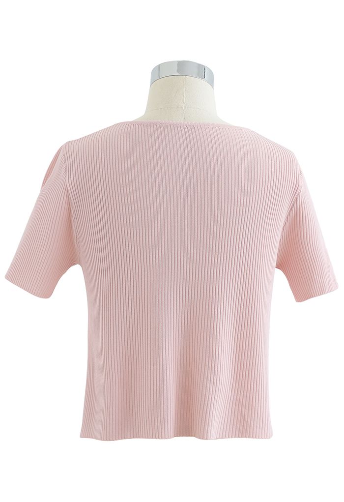 Haut en tricot côtelé à manches courtes et col en V boutonné en rose