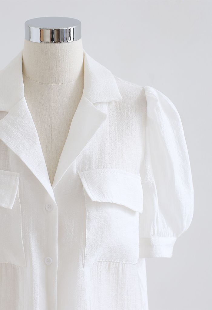 Chemise boutonnée à col cranté et poche à rabat en blanc
