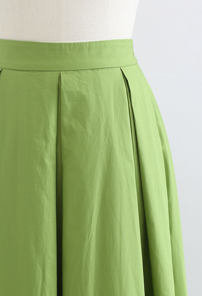 Jupe mi-longue trapèze à taille haute et plis creux en vert