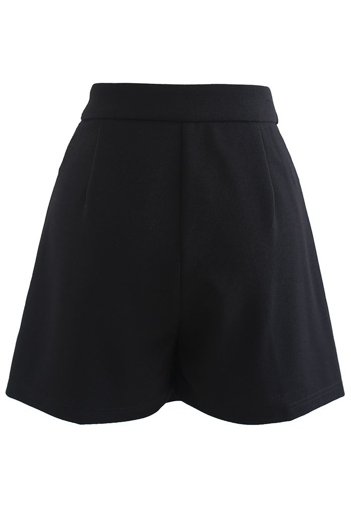 Mini jupe-short asymétrique à rabat en noir