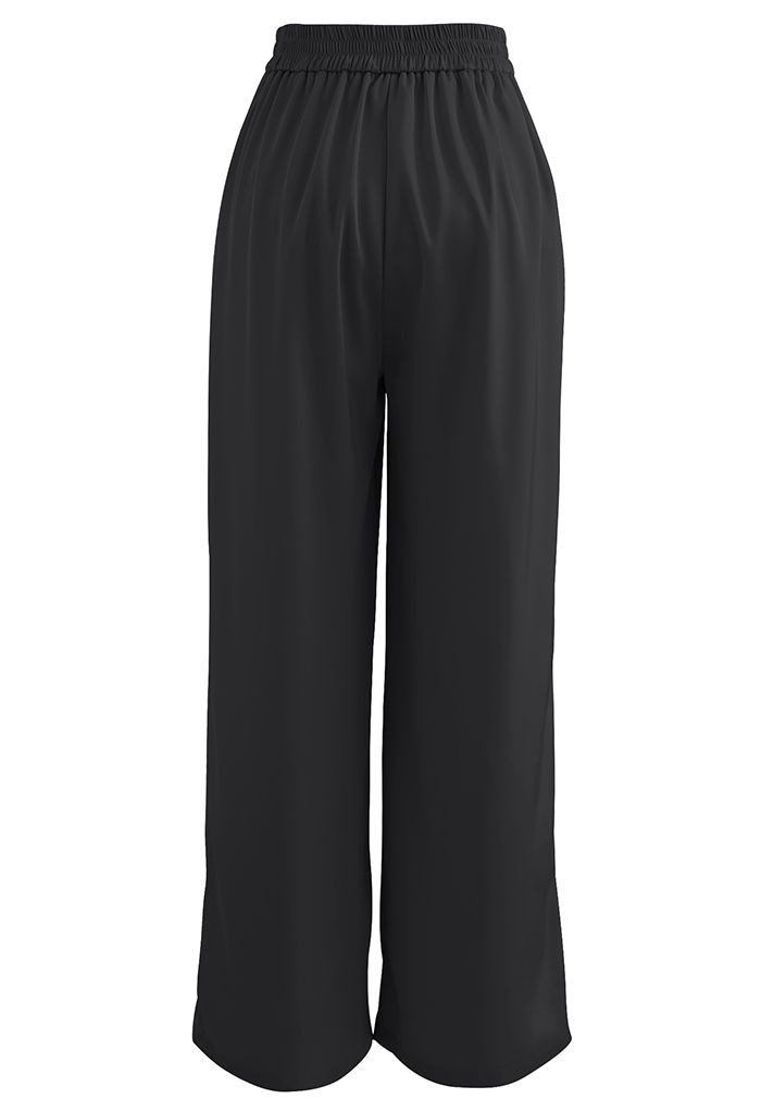 Pantalon large plissé brillant en noir