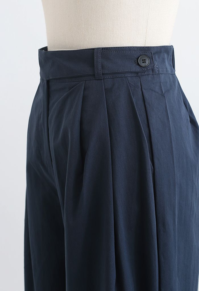Pantalon droit en coton à taille ceinturée en bleu marine