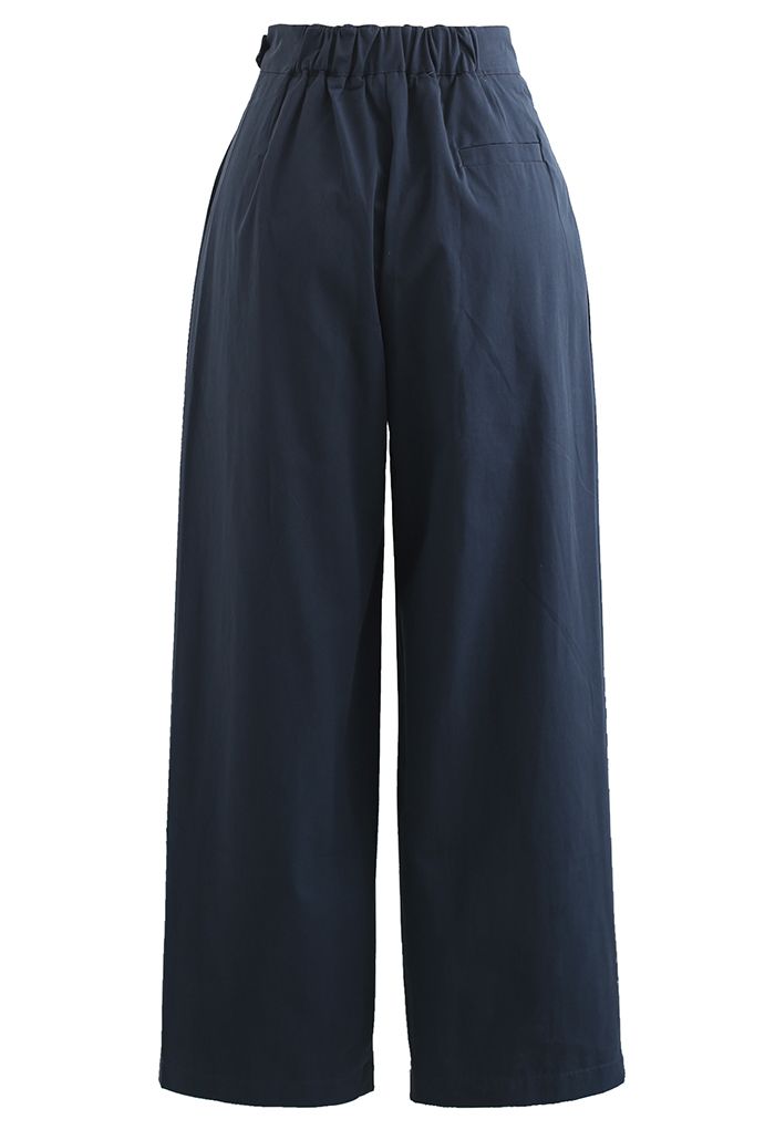 Pantalon droit en coton à taille ceinturée en bleu marine