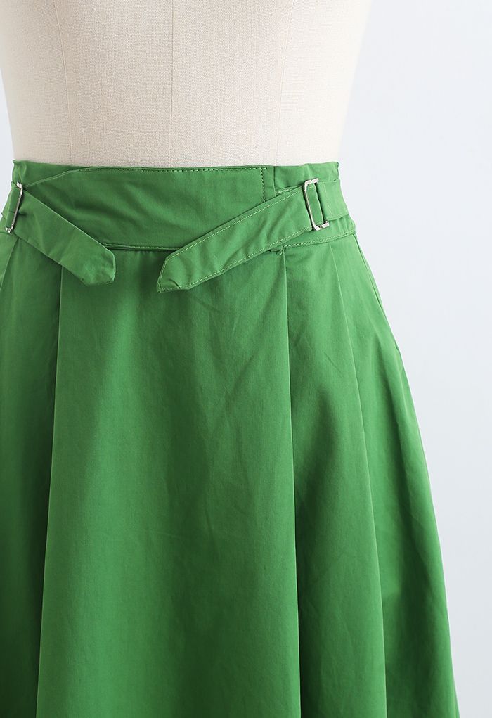 Jupe mi-longue plissée en coton à taille ceinturée en vert