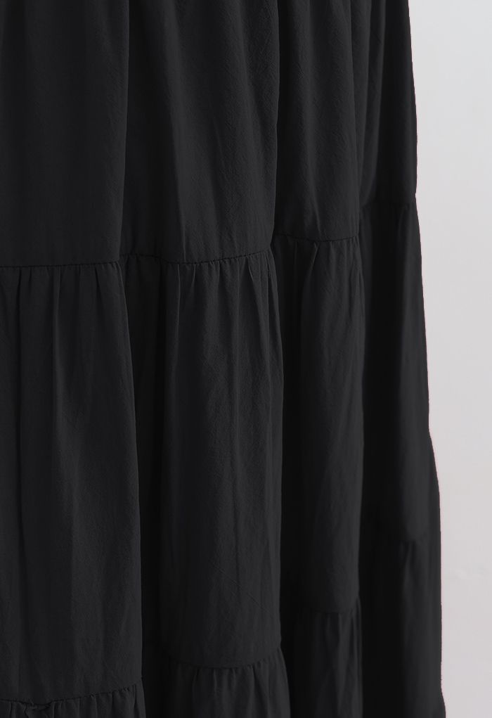 Jupe mi-longue en coton à volants de couleur unie en noir