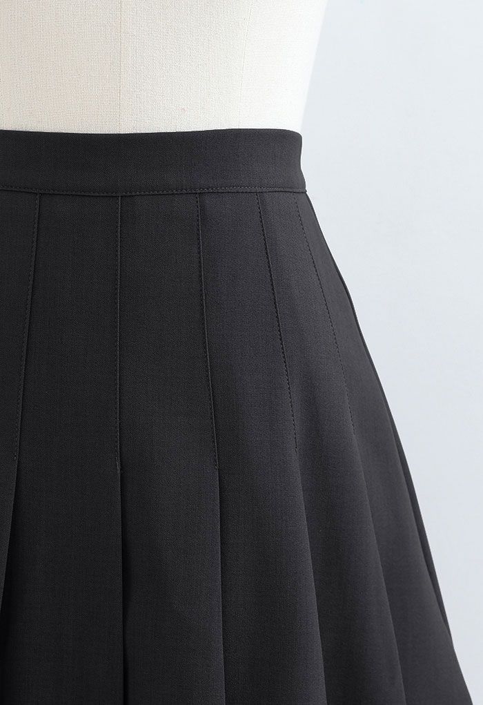 Mini-jupe plissée taille haute en noir