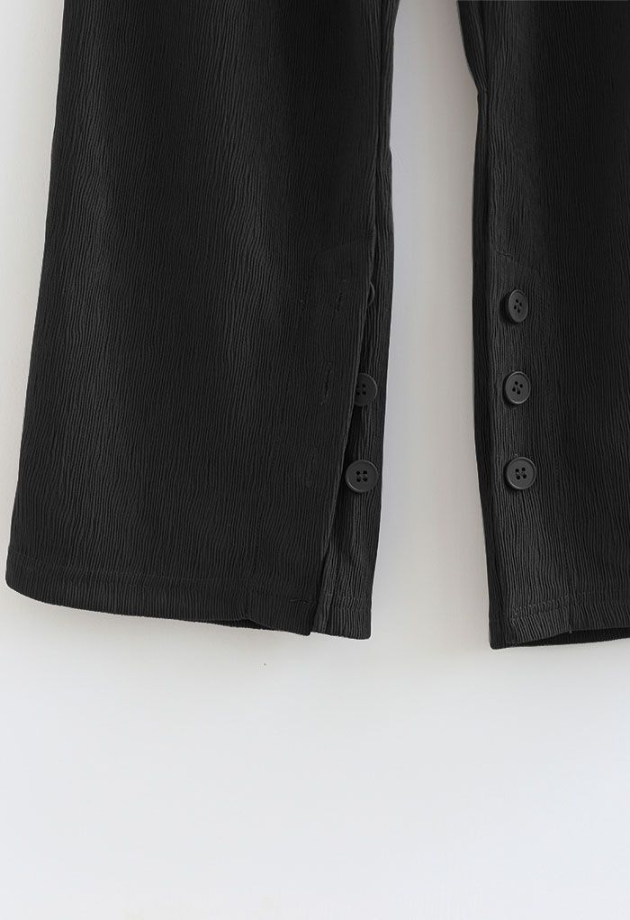 Pantalon à jambe droite avec poignets fendus boutonnés en noir