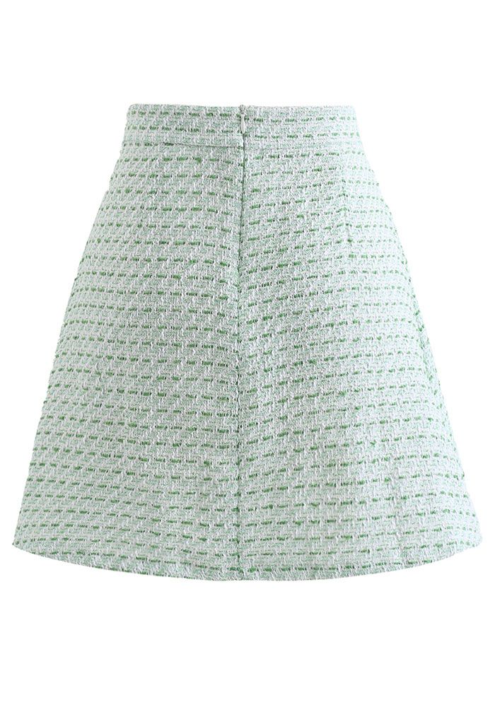 Mini-jupe verte en tweed à ourlet plissé sur le devant