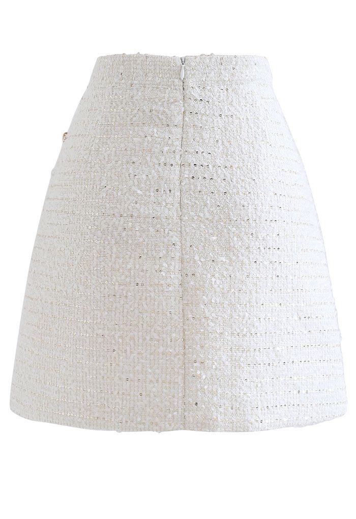 Mini-jupe en tweed à sequins et bordure boutonnée en blanc