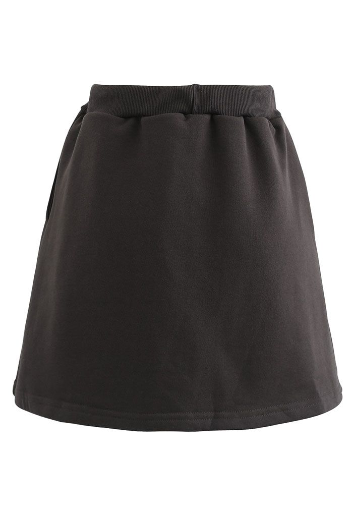 Mini jupe-short en coton avec poche à cordon en marron